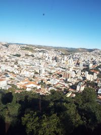 Aerial view of town against clear sky