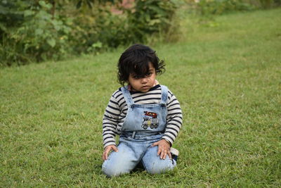 Full length of cute toddler on field