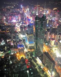 Aerial view of city lit up at night