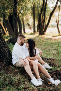 Young couple sitting on land