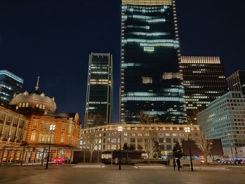 Illuminated city buildings at night