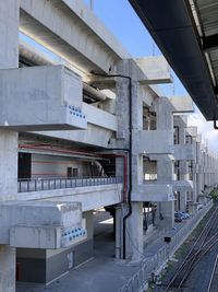 Railroad tracks amidst buildings in city