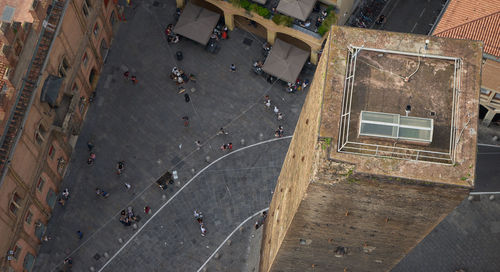 High angle view of people walking on road