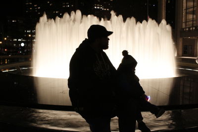 View of illuminated people at night