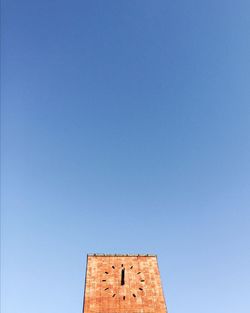 Low angle view of built structure against blue sky