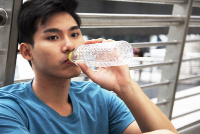 Young man drinking water