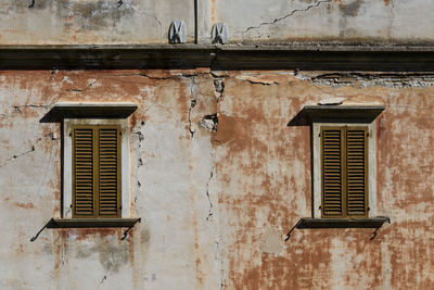 Low angle view of window on old building