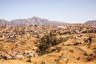 Scenic view of residential district against clear sky