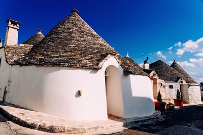 Exterior of historic building against blue sky