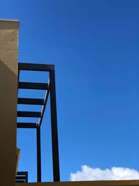 Low angle view of building against clear blue sky