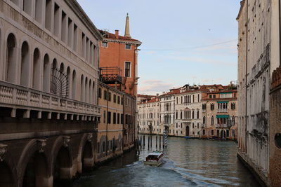 Canal amidst buildings in city