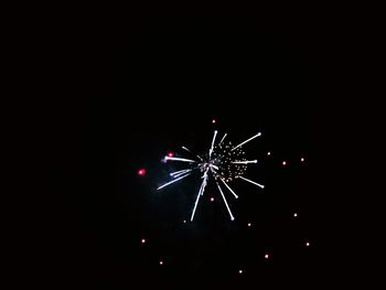 Low angle view of illuminated ferris wheel