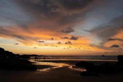 Scenic view of beach against sky during sunset