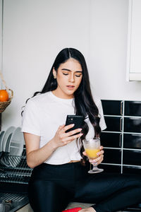 Young woman using mobile phone