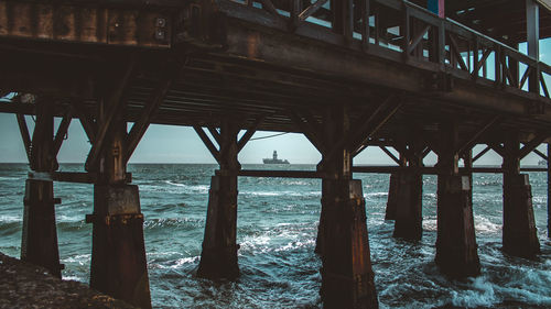 Pier over sea against sky