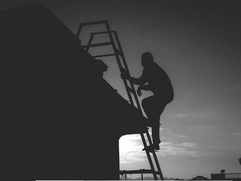Low angle view of silhouette person on staircase