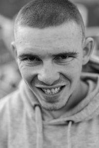 Close-up portrait of smiling young man