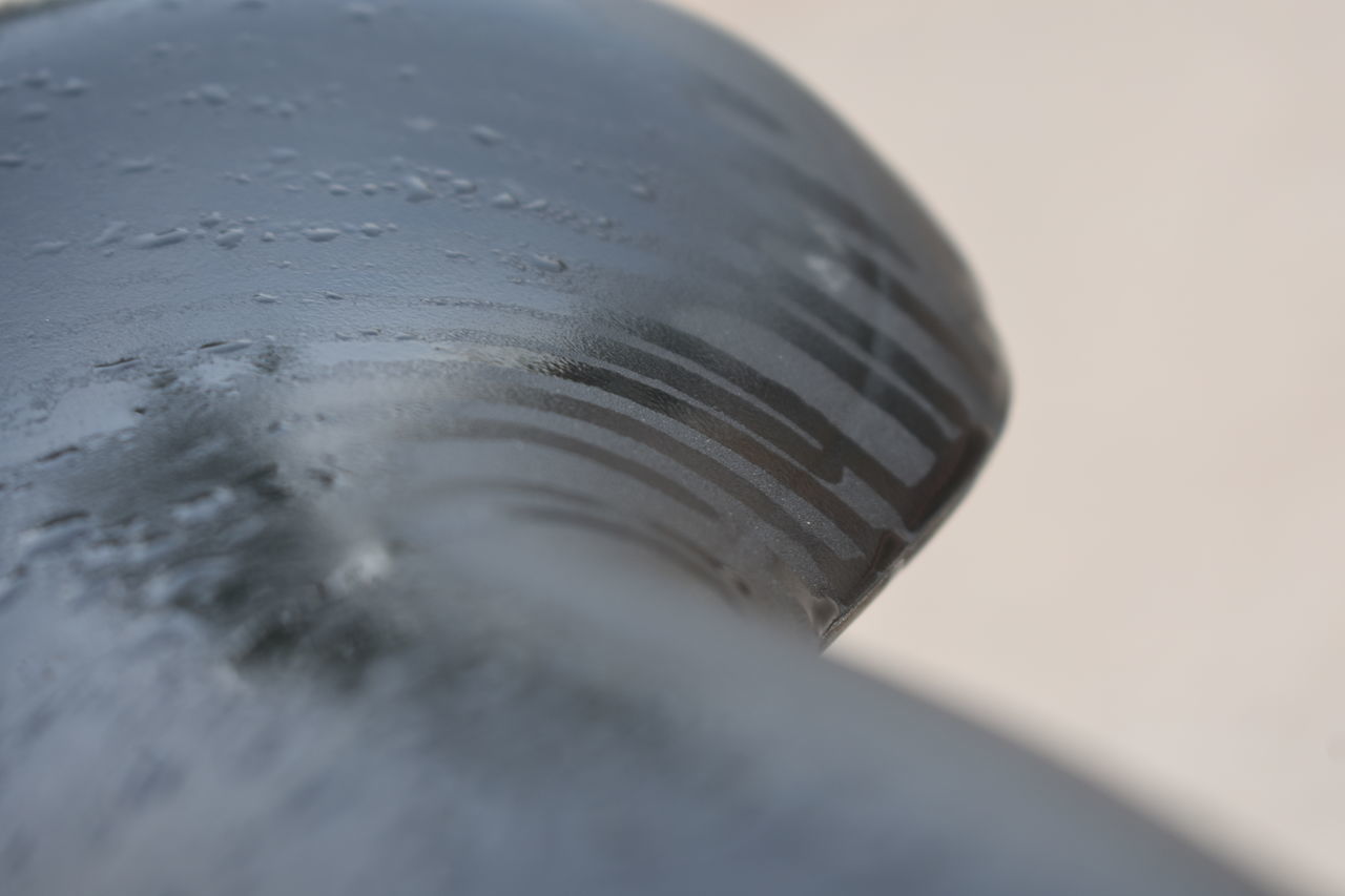CLOSE-UP OF WATER IN METAL