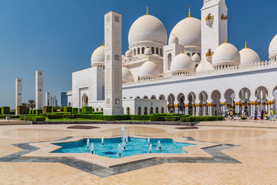 View of swimming pool against buildings in city