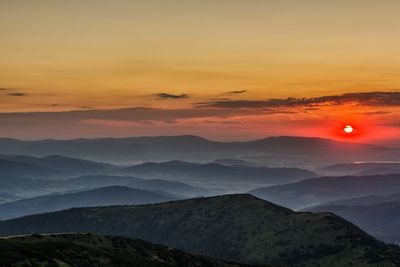 Scenic view of mountains against sky during sunset