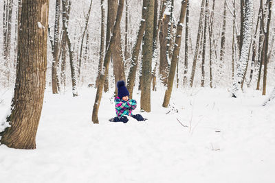 Full length of person on snow covered land