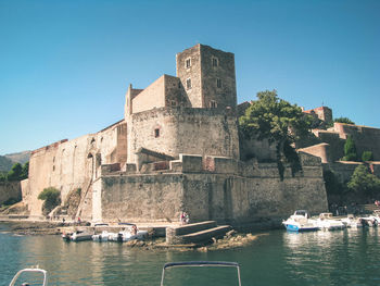 Buildings against clear blue sky