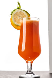 Close-up of beer glass against white background