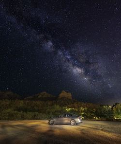 Low angle view of trees against sky at night