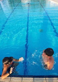 High angle view of people swimming in pool