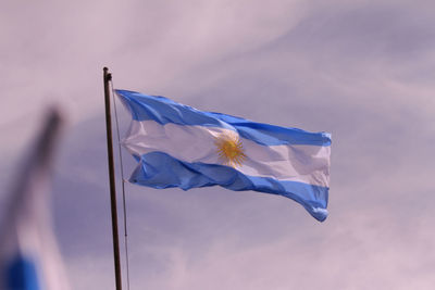 Low angle view of flag against sky