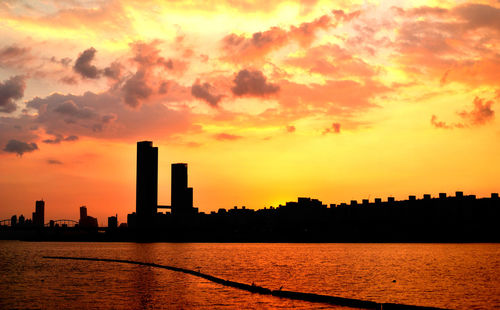 Silhouette of city at sunset