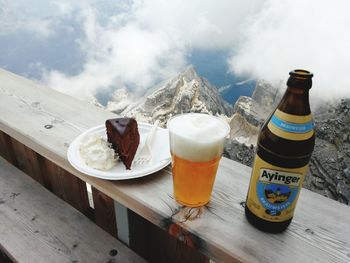 Food served on table against mountains during winter