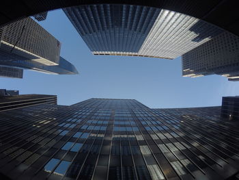 Low angle view of modern buildings against sky