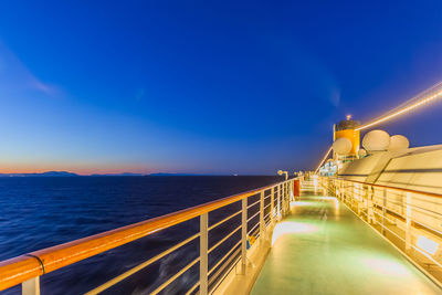 Scenic view of sea against blue sky at night from cruise ship deck 