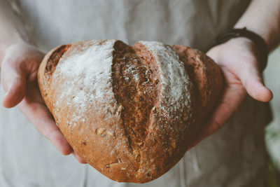 Close-up of hand holding bread