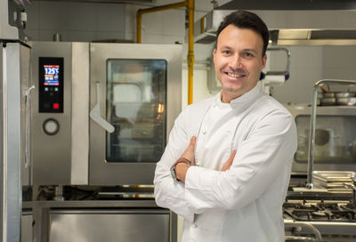 Portrait of smiling man standing at home