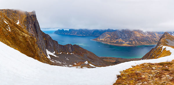 Scenic view of snowcapped mountains against sky