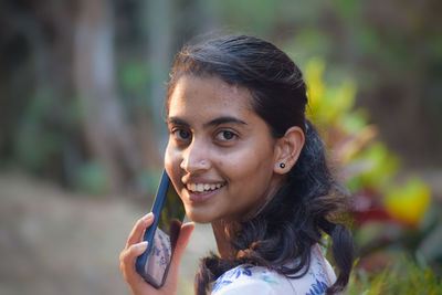 Portrait of young woman looking away