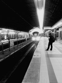 Railroad station platform at night