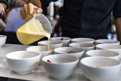 Chefs placing the menu items to their customers