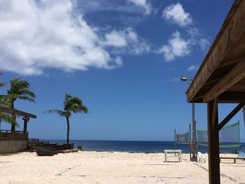 Scenic view of beach against blue sky