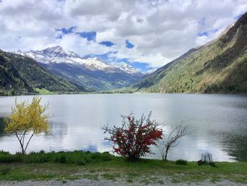 Scenic view of lake and mountains against sky