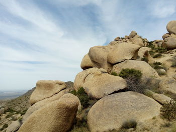 Close-up of rock formation against sky