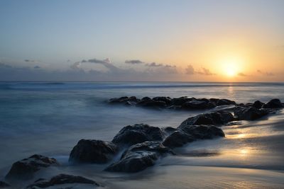 Scenic view of sea against sky during sunset