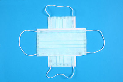 Directly above shot of blue table against white background