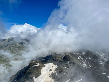 Scenic view of waterfall against sky