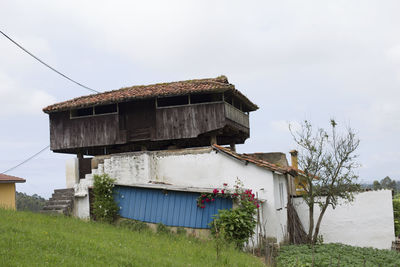 House on field against sky