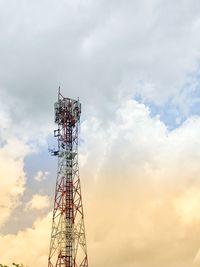 Low angle view of communications tower against sky