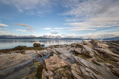 Sea with mountain in background