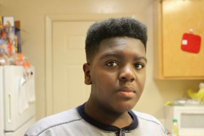 Close-up portrait of boy at home